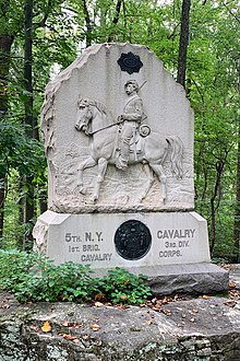 stone monument with a soldier on horseback