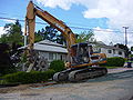 August 19th Crawler-backhoe with a narrow sheepsfoot roller