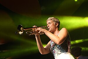 Young woman playing the trumpet