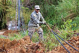 National Guard clearing trees from PR-184 after Hurricane Maria in 2017