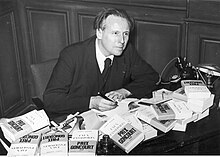Charles Plisnier signing copies of Faux passeports after receiving the Prix Goncourt, 1937