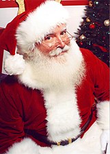 Santa Claus traditionally wears red, because the original Saint Nicholas was a bishop of the Greek Christian church in the 4th century.
