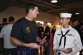 Chief Special Warfare Operator (SEAL) William Davis talks to a U.S. Naval Sea Cadet Corps cadet from the Seal Beach Battalion.