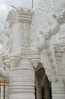 Intricate carving on a marble pillar