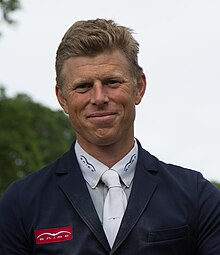 Head-and-shoulders image of equestrian Max Kühner facing the camera
