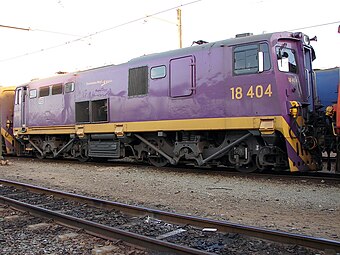 No. 18-404 (E1711) in PRASA's purple Shosholoza Meyl livery at Sentrarand, 8 October 2009