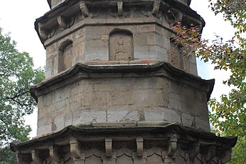 Storeys one through four with intact niche sculpture visible
