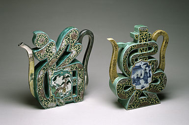 Pair of "Famille Verte" wine pots in the form of 福; fú on the left and the character 壽; shòu on the right