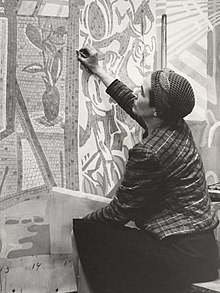 Reeves working on a mosaic mural