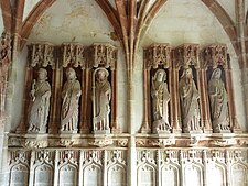 The six sculptures of apostles on the east side of the porch interior. They are, from left to right, Saints Peter, Andrew, James the Greater, John, Thomas and James the Lesser.