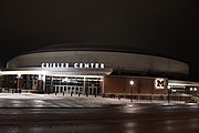 The exterior of Crisler Center at night.