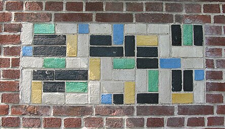 De Stijl - Panel of polychrome bricks on the exterior of the Vakantiehuis De Vonk, a house in Noordwijkerhout, the Netherlands, by Theo van Doesburg, 1917-1919[49]