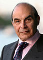 Image 6 David Suchet Photo credit: Phil Chambers A portrait of David Suchet OBE, an English actor best known for his television portrayal of Agatha Christie's Hercule Poirot in the television series Agatha Christie's Poirot. For this role, he earned a 1991 British Academy Television Award (BAFTA) nomination. In preparation for the role he says that he read every novel and short story, and compiled an extensive file on Poirot. More featured pictures