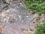 Petroglyphs in Vanuatu, with the concentric circles and swirling designs characteristic of the Austronesian Engraving Style