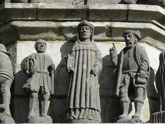 St Yves stands between a poor and a rich man.