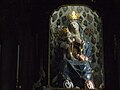 Wooden statue of the Virgin with baby Jesus standing on her knees