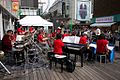 Big band giving a concert just outside a department store in the middle of the shopping district Kichijoji