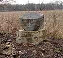 Offield Monument on road near creek