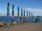 Serges heavily adorned with ribbons and scarves at Cape Burhan on Olkhon Island