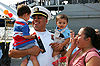 A returning sailor is reunited with family after a deployment