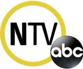 In a large white circle with a yellow border, the letters N T V, with the N in bold. The ABC network logo, a black disk with the letters a b c, overlaps it on the lower right.
