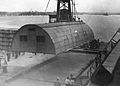 A Quonset hut being put in place at the 598th Engineer Base Depot in Japan, post-World War II