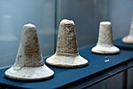 Three foundation cones from southern Iraq. The names of Gudea, Ur-Nammu, and Lipit-Ishtar. From Ur, Kish, and Warka, Iraq. Iraq Museum