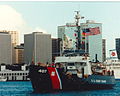 Original USCG caption: "Solid Gold! Woodrush returns to port after the final battle problem for REFTRA 92 earning a 5th consecutive clean sweep!"; 1992.