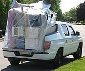 2011 Ridgeline hauling cargo in the extended bed (tailgate down) with aftermarket exterior accessories (Canadian model)