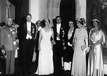 Several men and women in formal wear