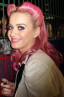 Katy Perry smiling towards the camera.