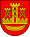 A coat of arms depicting a golden castle with three turrets surrounded with four golden stars all on a red background