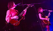 Sleater-Kinney performing live.