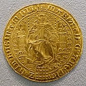 Gold coin showing a woman seated on a throne