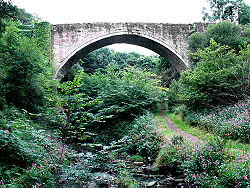 Stone arch railway bridge