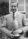 Henry Cotton holding the Claret Jug, having won the 1937 Open