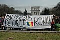 Demonstrators in Chișinău, Moldova, holding a banner