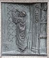 "Thomas Benet nails his protest against the Cathedral Door AD 1531". 1909 Bronze relief sculpted panel by Harry Hems showing protest by Protestant martyr Thomas Benet which earned him martyrdom in 1531 at Livery Dole, Exeter. Affixed to the base of the Protestant Martyrs' Monument, Denmark Road, Exeter, Devon.