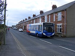 Picture of a bus on Mill Lane to the north of Whitburn.