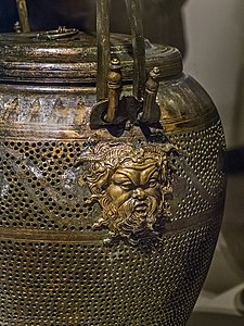 Closeup of Pan relief on bronze lantern
