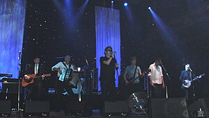 The Pogues performing in Munich in 2011. From left to right: Philip Chevron, James Fearnley, Andrew Ranken, Shane MacGowan, Darryl Hunt, Spider Stacy and Jem Finer.