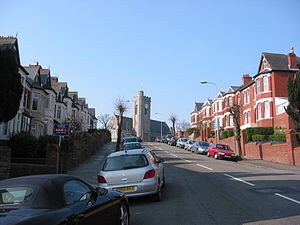 A typical street in Barry, All Saints Church pictured at the top of the hill