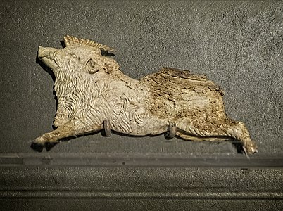 Ivory plaque depicting a boar from the footrest of Philip II's funeral couch