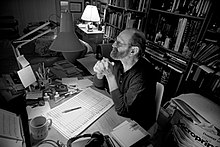 David van de Pitte at his writing desk. Photo by Eric van den Brulle
