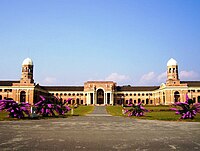 The front view of the main Forest Research Institute (India) building