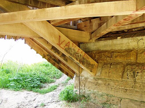 Sim Smith Covered Bridge, Parke County, Indiana. Notice the arch projects below the lower chords of the bridge.