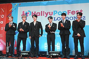 Oneus standing at an event.