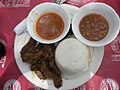 Image 4Ugali, served here with beef and sauce, is a mainstay of the cuisine throughout the African Great Lakes region. (from Culture of Kenya)