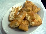 Fried bread (油炸鬼), shared by most Han Chinese groups, is common in breakfast.