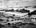 Image 3 Invasion of Normandy Photo credit: United States Coast Guard Landing ships putting ashore on Omaha Beach at low tide during the first days of the Invasion of Normandy, mid-June, 1944. Barrage balloons fly overhead and U.S. Army "half-tracks" form a convoy on the beach. The Normandy landing was the largest seaborne invasion in history, with almost three million troops crossing the English Channel. More featured pictures